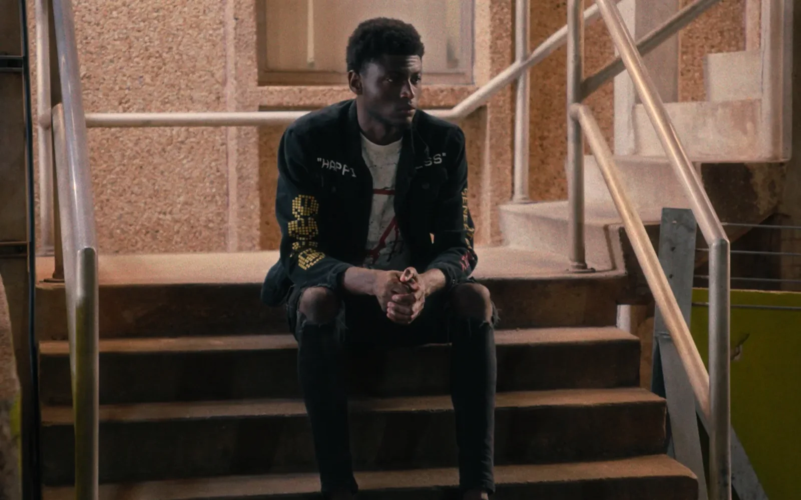 Client seated on courthouse steps in an emotional law firm brand video scene